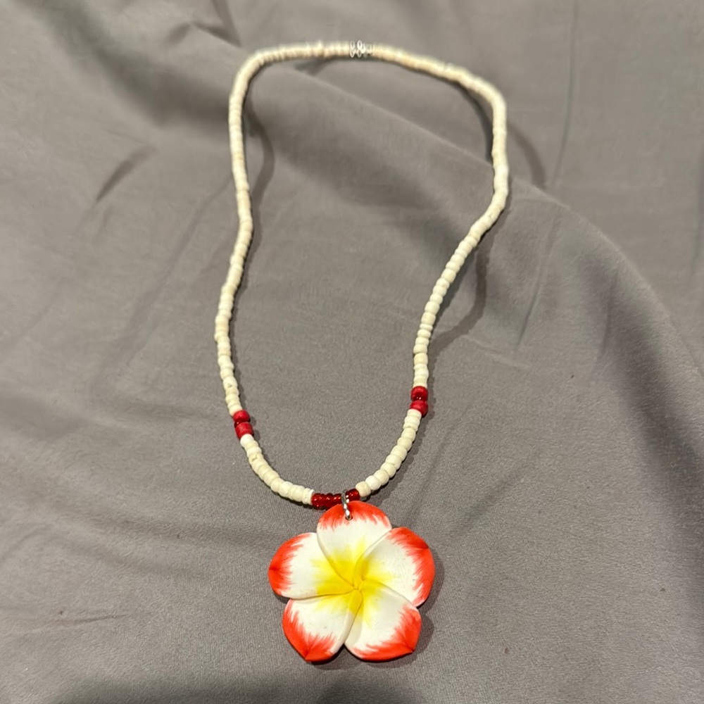 Hawaiis famous clam shell Elegant Floral Necklace with Red and Yellow Accents